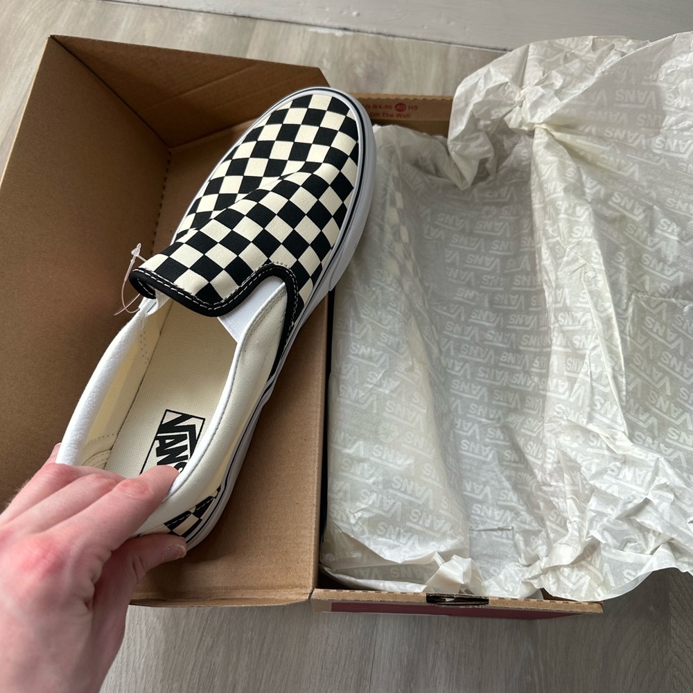 Black and White Checkered board Vans.
